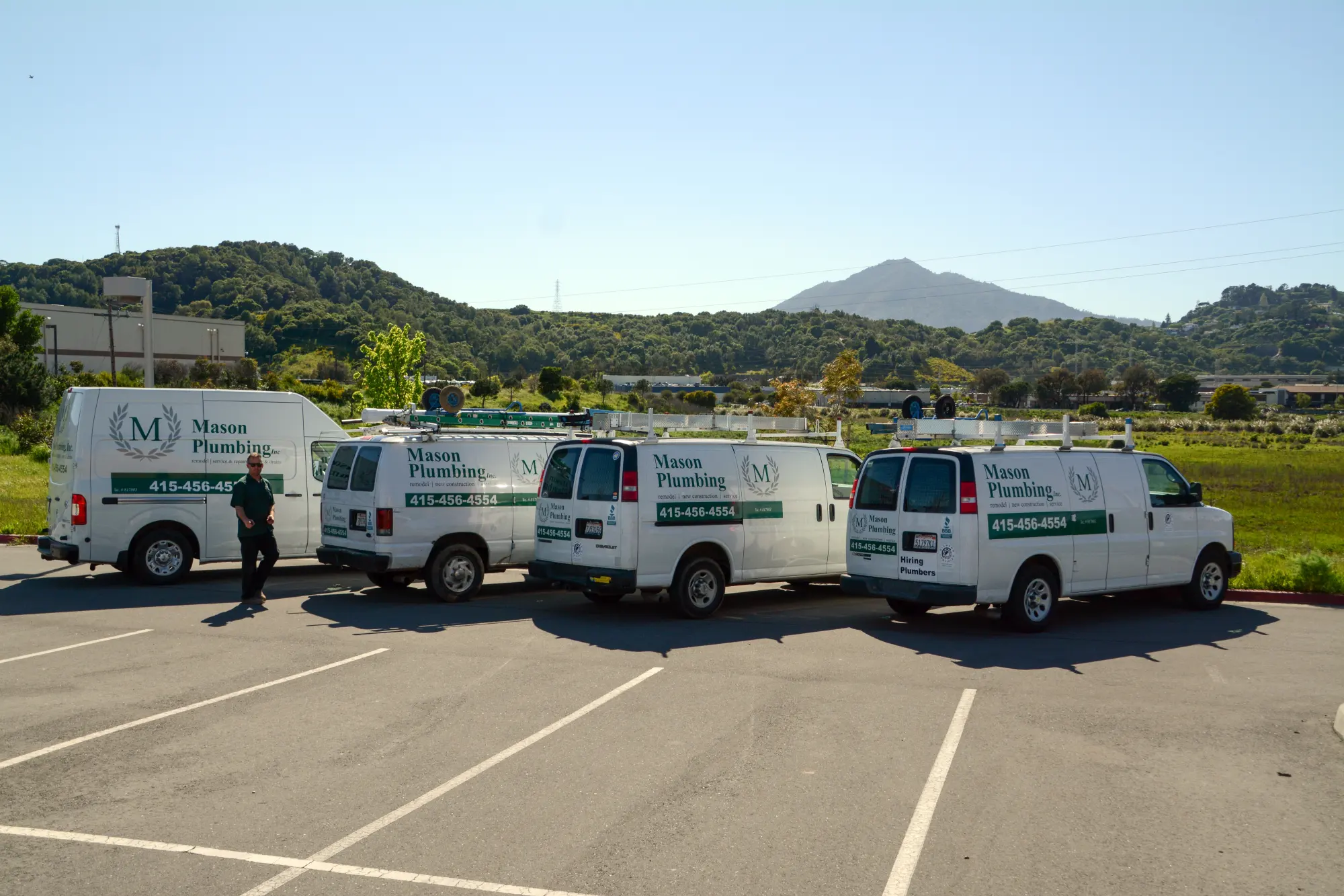 Mason Plumbing vans parked below Mount Tamalpais